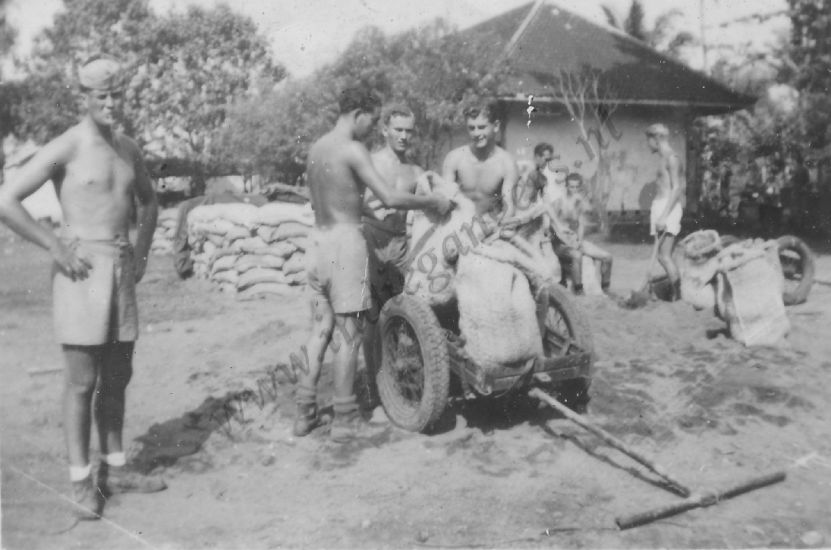 3 zakken laden op kar